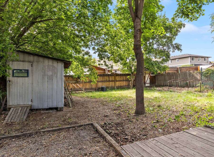Discover the potential of this spacious backyard, perfect for gardening and outdoor activities.