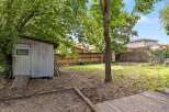Discover the potential of this spacious backyard, perfect for gardening and outdoor activities.