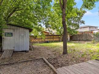 Discover the potential of this spacious backyard, perfect for gardening and outdoor activities.