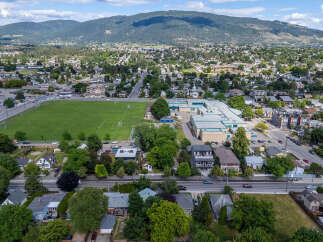Discover this prime real estate opportunity featuring a spacious school complex adjacent to a vibrant community sports field.