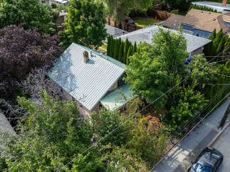 Discover this charming home nestled amidst lush greenery, offering a private and serene retreat.