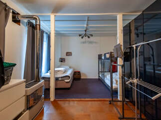 Discover comfortable and practical living with this versatile room featuring a cozy single bed and a bunk bed setup, perfect for families or accommodating guests.