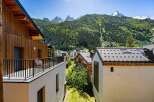 Experience breathtaking mountain views from this stunning property, nestled amidst lush green forests and majestic peaks.