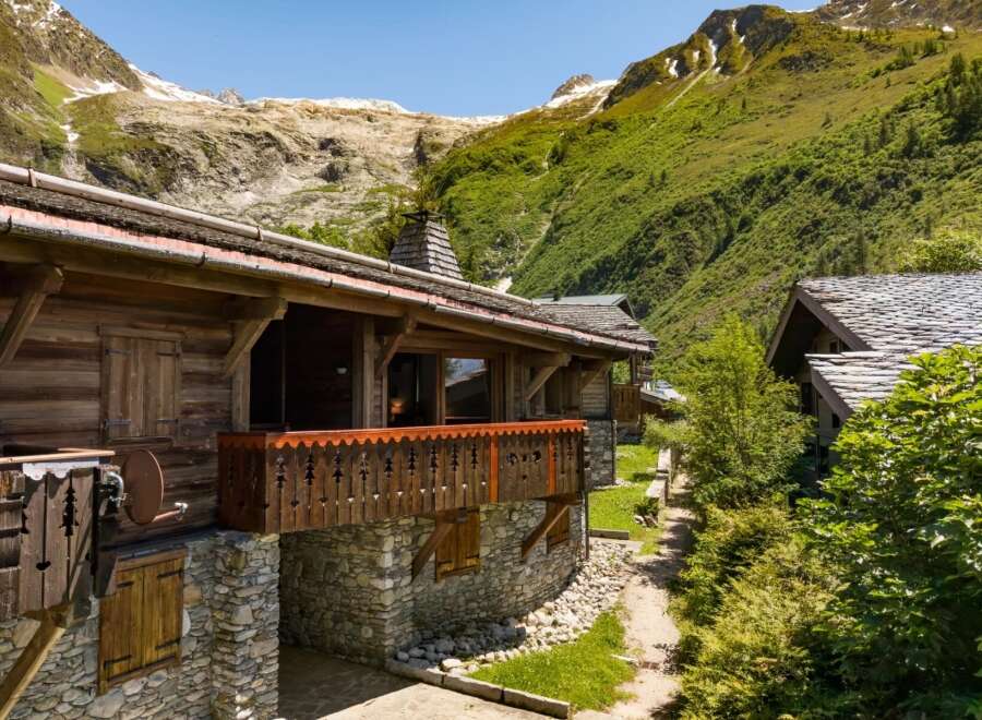 Experience alpine luxury in this stunning wooden chalet nestled amidst breathtaking mountain scenery.