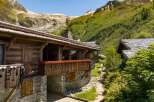 Experience alpine luxury in this stunning wooden chalet nestled amidst breathtaking mountain scenery.