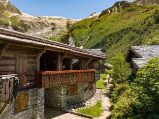 Experience alpine luxury in this stunning wooden chalet nestled amidst breathtaking mountain scenery.