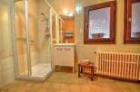 This charming bathroom features a spacious glass-enclosed shower, perfect for a refreshing start to your day.