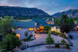 Experience luxury living in this stunning estate, nestled against a backdrop of majestic mountains.