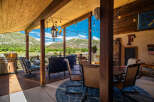 Enjoy breathtaking mountain views from this covered patio, perfect for outdoor entertaining.