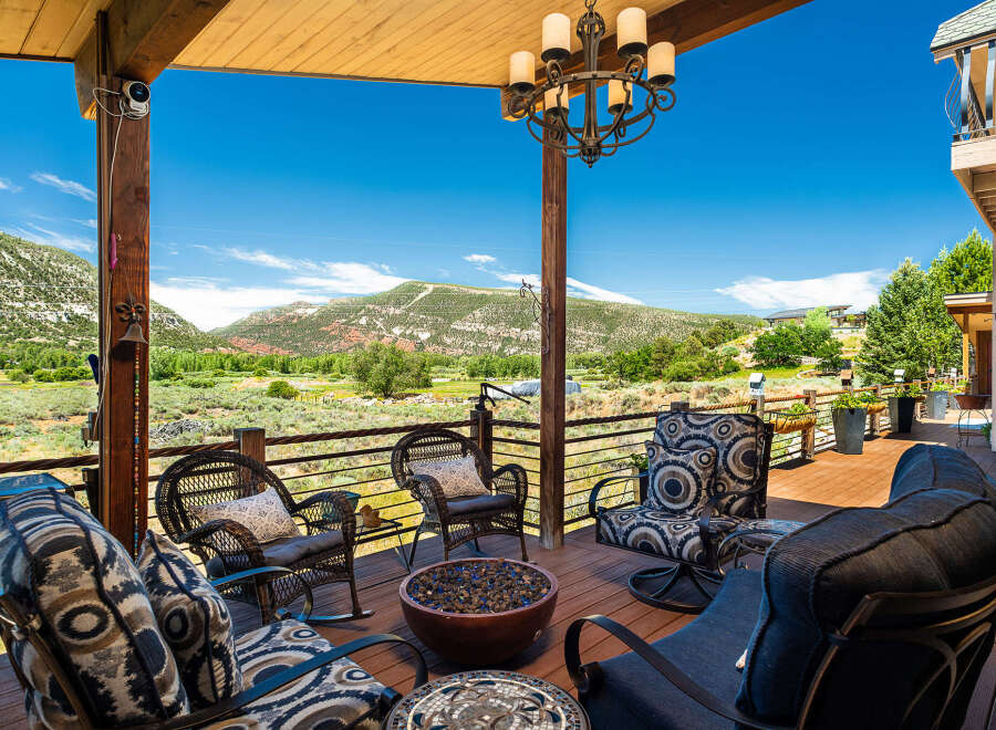 Enjoy breathtaking mountain views from this expansive deck, perfect for entertaining or relaxing.
