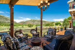 Enjoy breathtaking mountain views from this expansive deck, perfect for entertaining or relaxing.