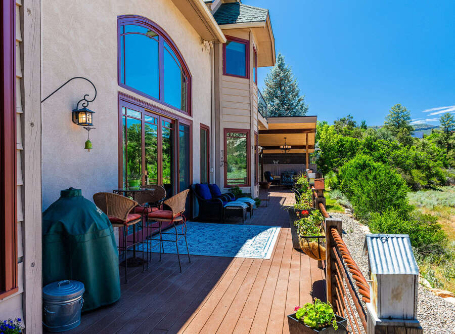 Enjoy outdoor living on this spacious deck with stunning mountain views.