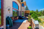 Enjoy outdoor living on this spacious deck with stunning mountain views.