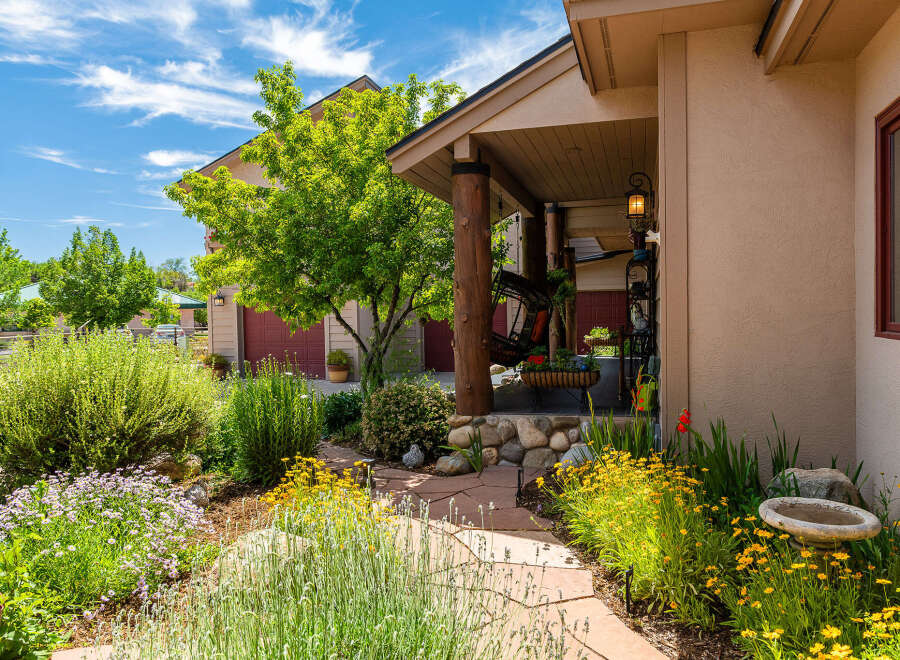 Welcome to this charming home featuring a beautiful front porch with a swing, perfect for relaxing evenings.