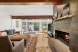 Experience cozy living in this inviting living room, featuring a warm fireplace and comfortable seating.