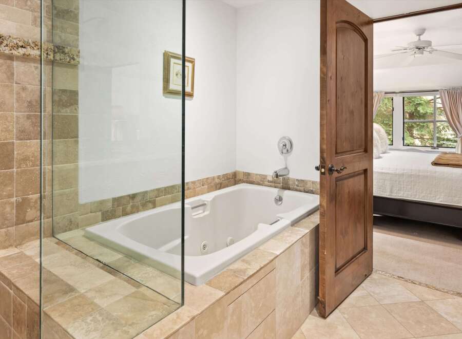 Indulge in relaxation with this luxurious jetted bathtub, perfect for unwinding after a long day.