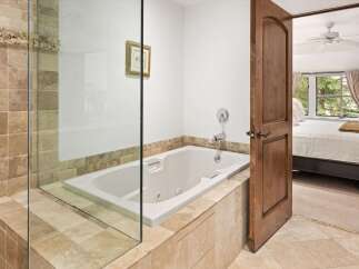 Indulge in relaxation with this luxurious jetted bathtub, perfect for unwinding after a long day.