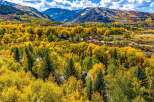 Experience the breathtaking beauty of autumn in this stunning mountain home, nestled amidst a vibrant tapestry of golden aspen trees.