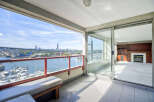 Enjoy breathtaking waterfront views from this spacious balcony, perfect for relaxing or entertaining.