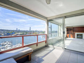 Enjoy breathtaking waterfront views from this spacious balcony, perfect for relaxing or entertaining.