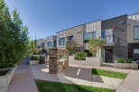 Experience modern urban living in this stunning townhouse complex, featuring sleek architecture and private balconies.