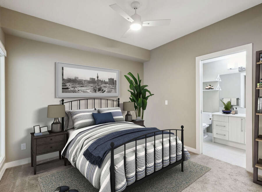 Experience modern comfort in this beautifully appointed bedroom, featuring a stylish metal-frame bed with elegant striped bedding and a cozy navy throw.
