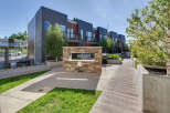 Discover modern living in this row of contemporary townhouses featuring sleek metal siding and warm wood accents.