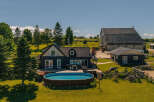Escape to this stunning rural property featuring a modern dark-clad home with a spacious deck and above-ground pool, perfect for summer relaxation.