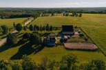 Discover this stunning rural estate featuring a spacious home with a private pool, a large barn, and a dedicated riding arena.