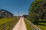 Discover this charming rural property featuring a classic wooden barn with 'TRIVUE RIDGE' signage, perfect for agricultural use or conversion.