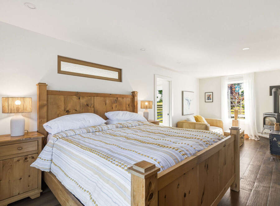 Experience rustic charm and modern comfort in this inviting bedroom.