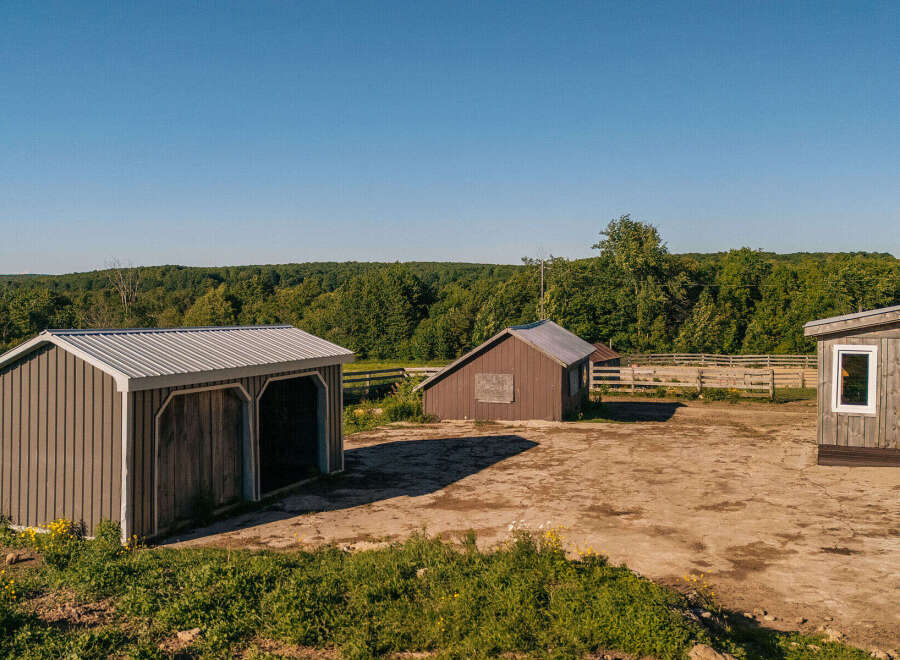Discover this charming rural property featuring multiple outbuildings, perfect for storage or equestrian use.