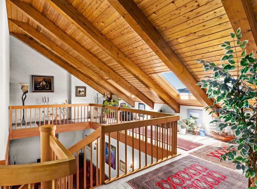 Ascend to a lofted paradise with stunning vaulted wood-beam ceilings and a skylight offering breathtaking views.