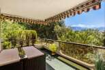 Enjoy breathtaking mountain views from this charming balcony, perfect for al fresco dining or morning coffee.