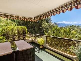 Enjoy breathtaking mountain views from this charming balcony, perfect for al fresco dining or morning coffee.
