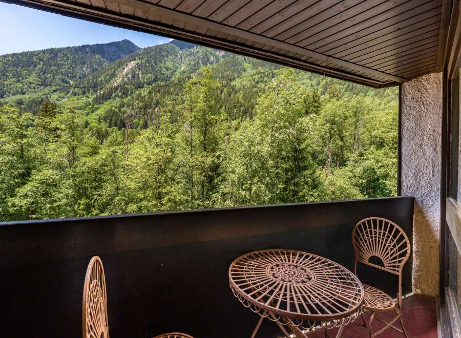 Enjoy breathtaking mountain views from this charming balcony, perfect for your morning coffee or evening relaxation.