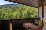 Enjoy breathtaking mountain views from this charming balcony, perfect for your morning coffee or evening relaxation.