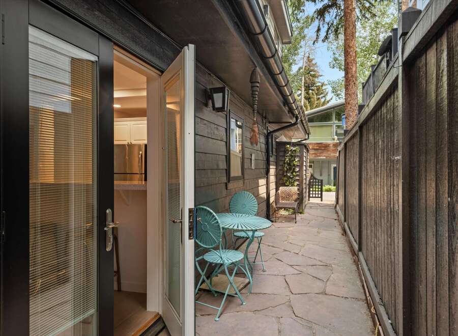 Step outside into a charming patio area, perfect for enjoying your morning coffee or evening drinks.