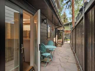 Step outside into a charming patio area, perfect for enjoying your morning coffee or evening drinks.