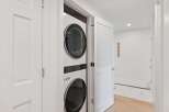 Discover modern convenience with this stacked LG washer and dryer set, perfect for maximizing space in your home.
