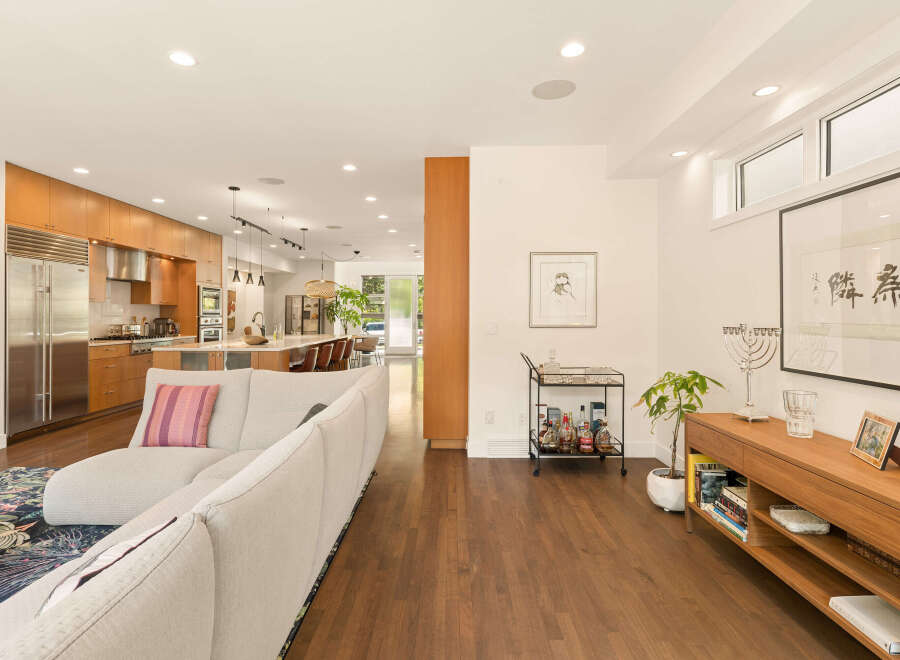 Experience modern living in this open-concept home featuring a gourmet kitchen with sleek cabinetry and stainless steel appliances.