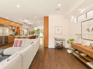 Experience modern living in this open-concept home featuring a gourmet kitchen with sleek cabinetry and stainless steel appliances.