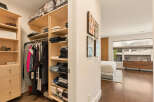 Step into a spacious walk-in closet featuring ample shelving and hanging space, perfect for organizing your wardrobe.