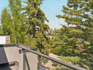 Enjoy breathtaking views from this elevated balcony, offering a serene escape amidst lush greenery.