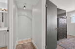 Step into this inviting hallway, featuring a stylish ceiling light and a smoke detector for added safety.