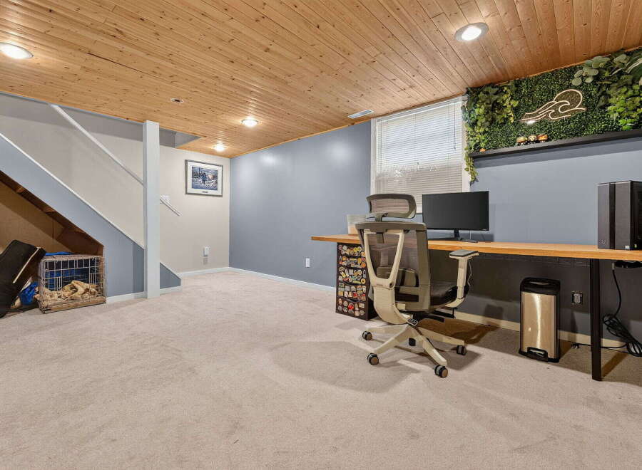Discover a versatile basement space perfect for a home office or recreation area.