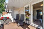 Enjoy outdoor living on this charming patio, perfect for summer barbecues with its included grill.