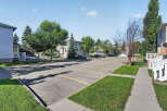 Discover this charming property featuring a well-maintained parking lot with ample space for residents and guests.
