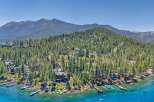 Experience luxury lakeside living with this stunning property featuring a private dock and breathtaking mountain views.