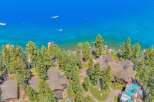 Experience luxury living with this stunning aerial view of a lakeside estate.
